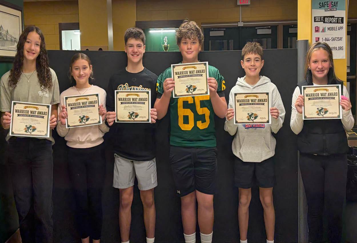 A group of six students holding certificates, smiling together.