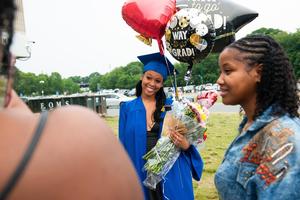 Graduate and loved ones after the ceremony