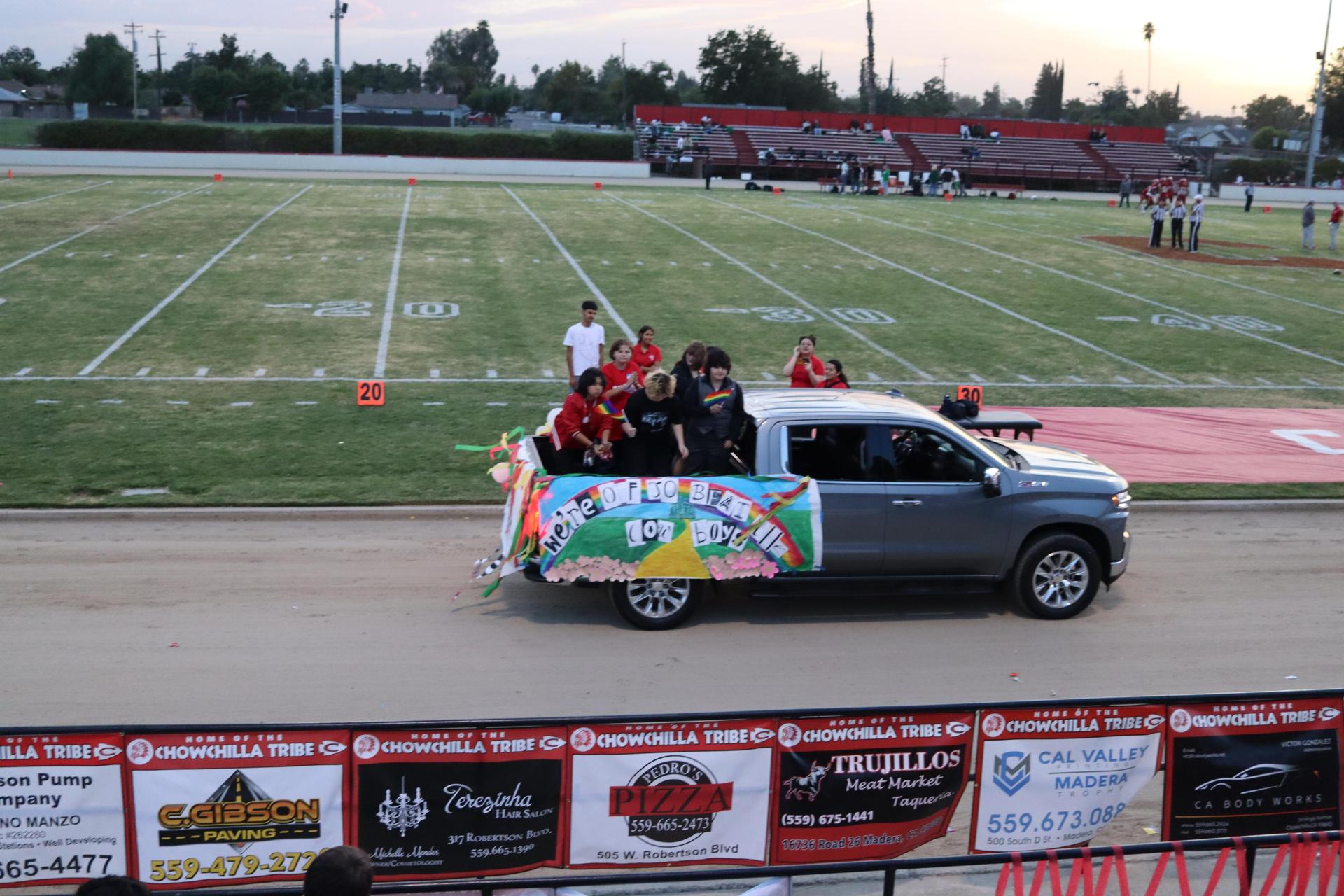students, staff, and community members enjoying Friday night at the football game