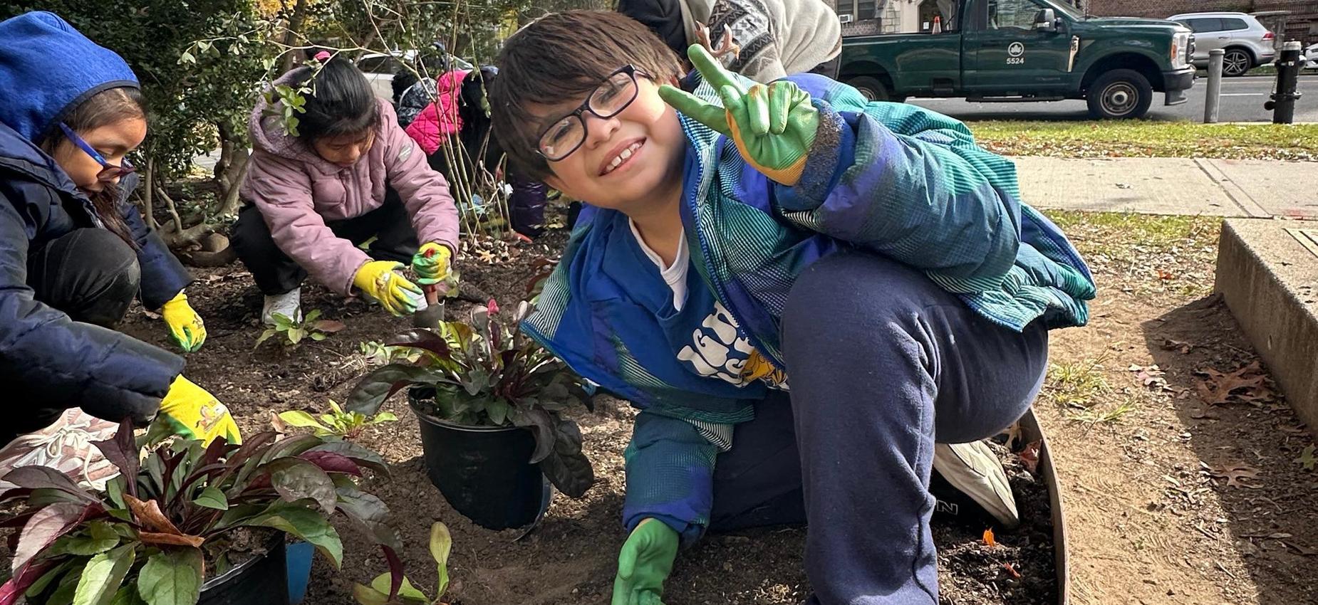 students planting at Forest Park