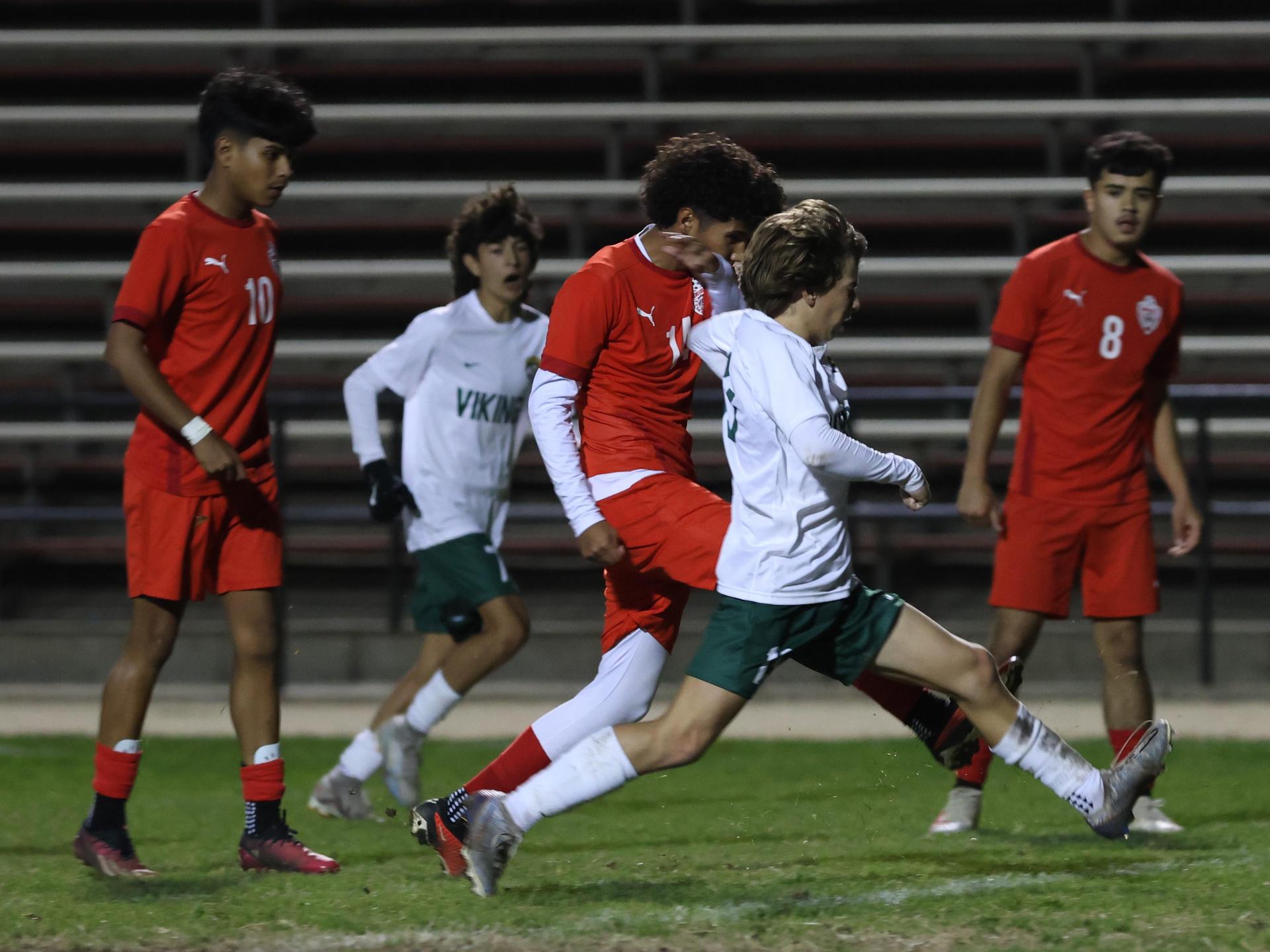 Varsity boys play soccer against Kingsburg