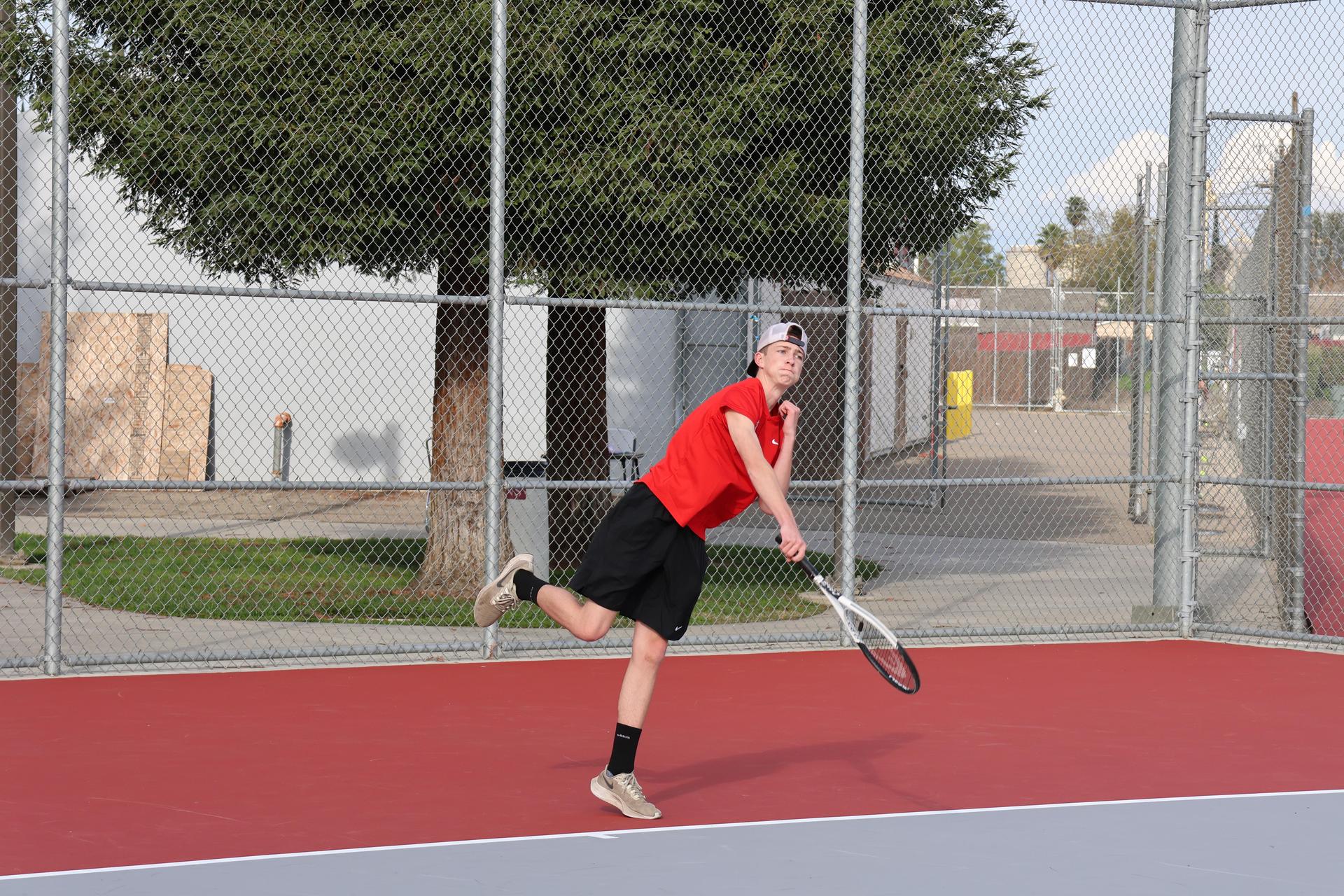 CUHS Boys playing tennis against coalinga