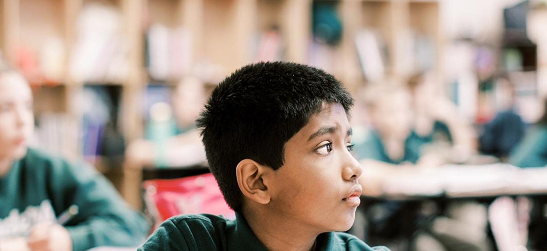 Student looks up attentively during class