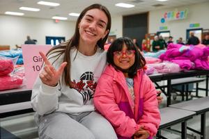 westwind student smiling with texas tech womens basketball player
