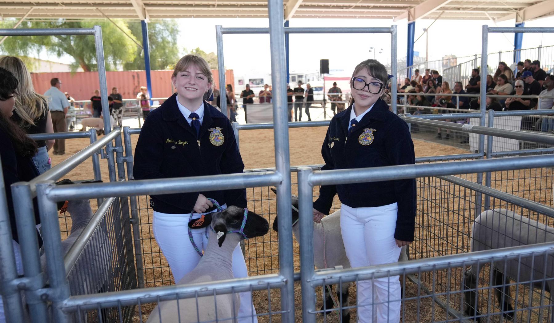 two FFA students with their sheep