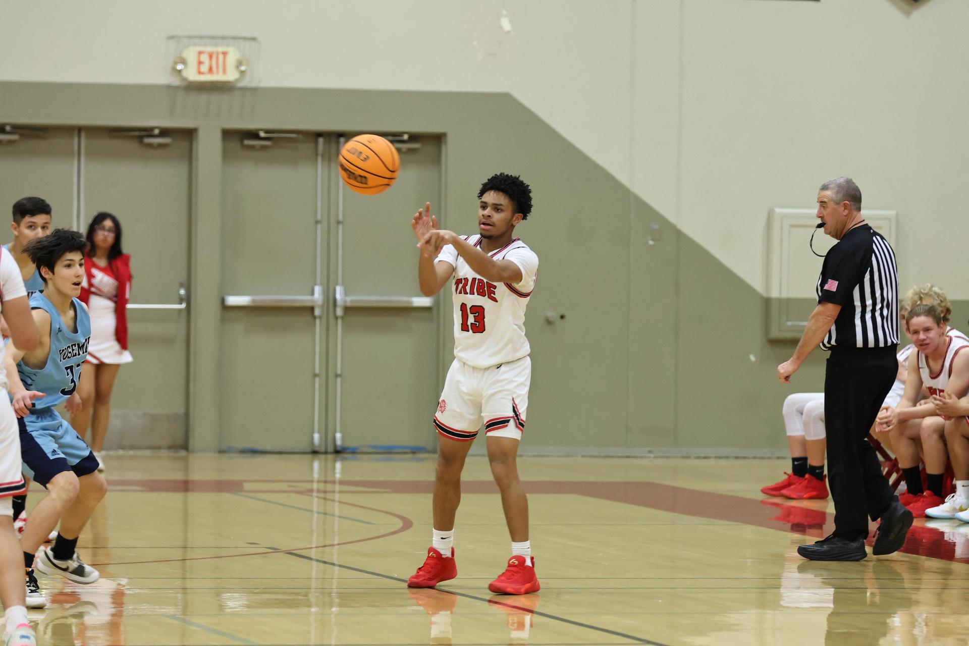 junior varsity boys playing basketball against yosemite