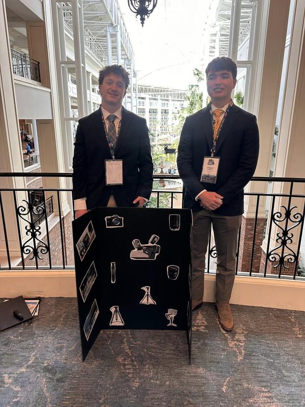 FHS 9th place video production team with their poster board