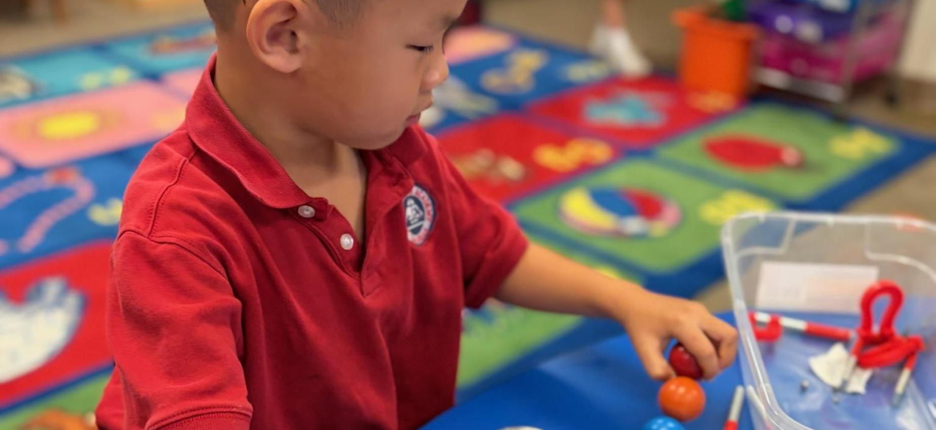 TK student exploring with magnets