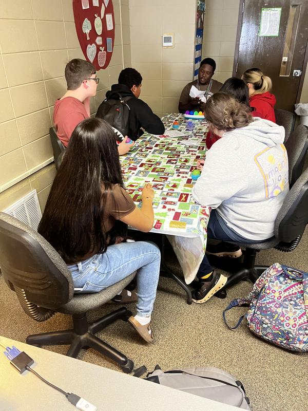 Educator Preparation ambassador talking to students