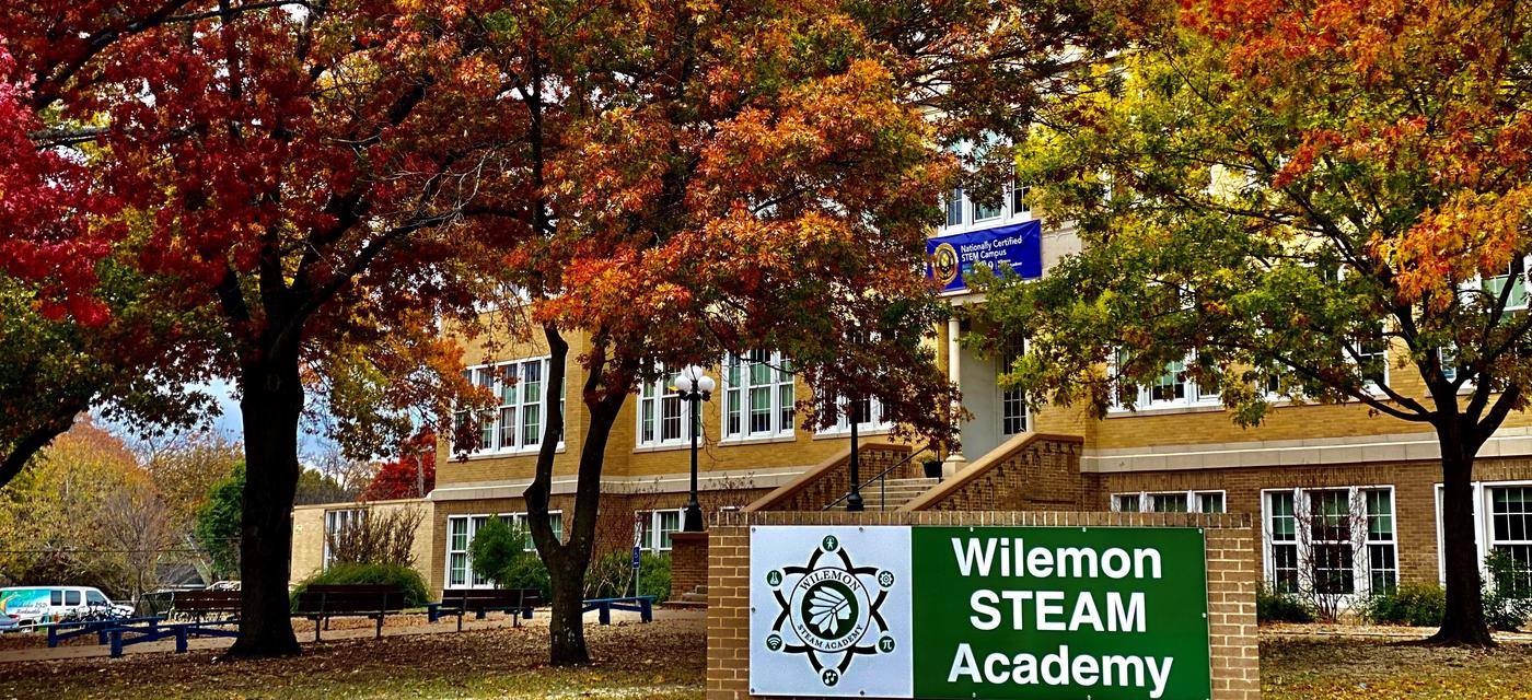 exterior of campus with colorful fall leaves