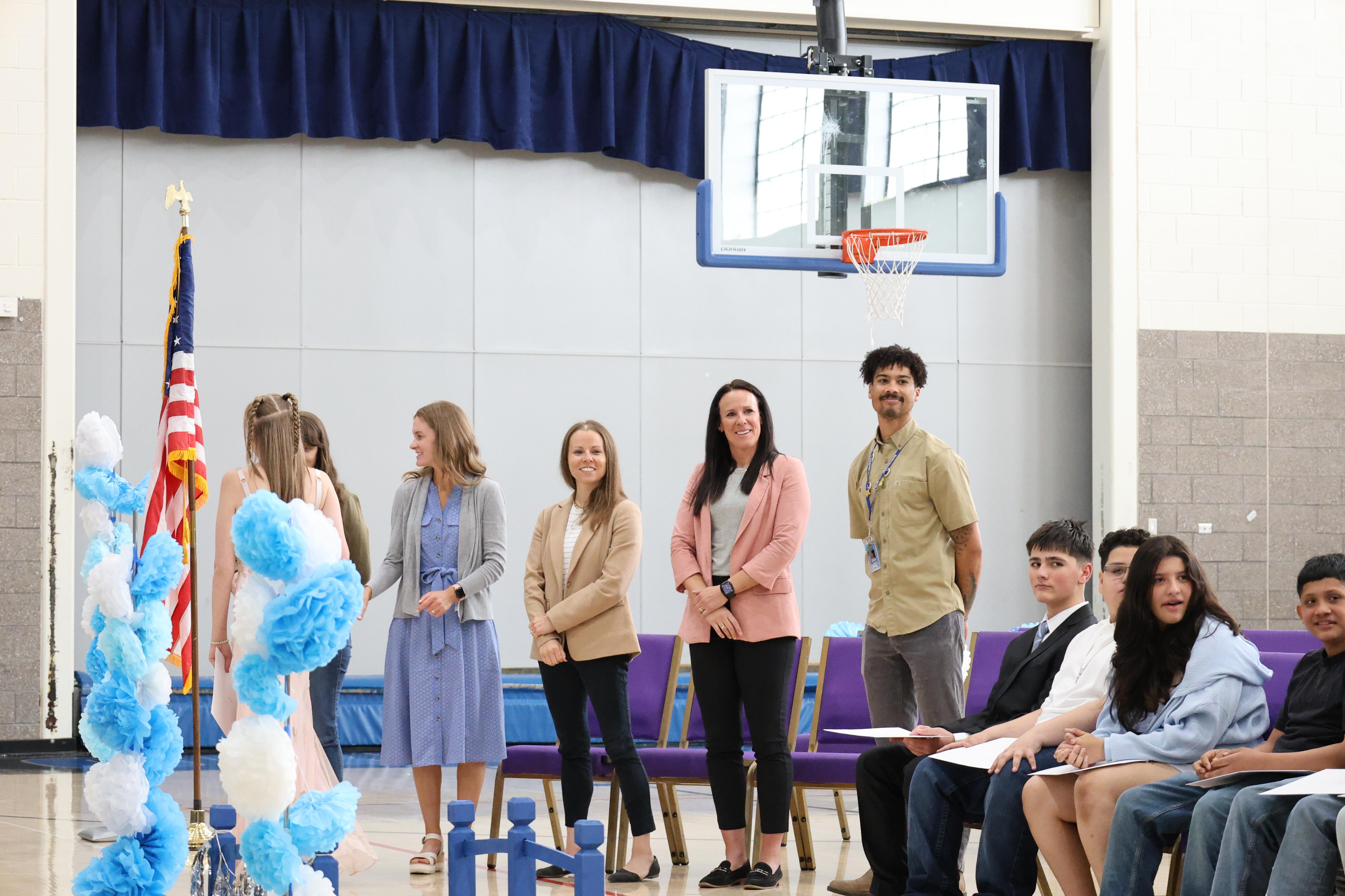 Teachers standing up at continuation