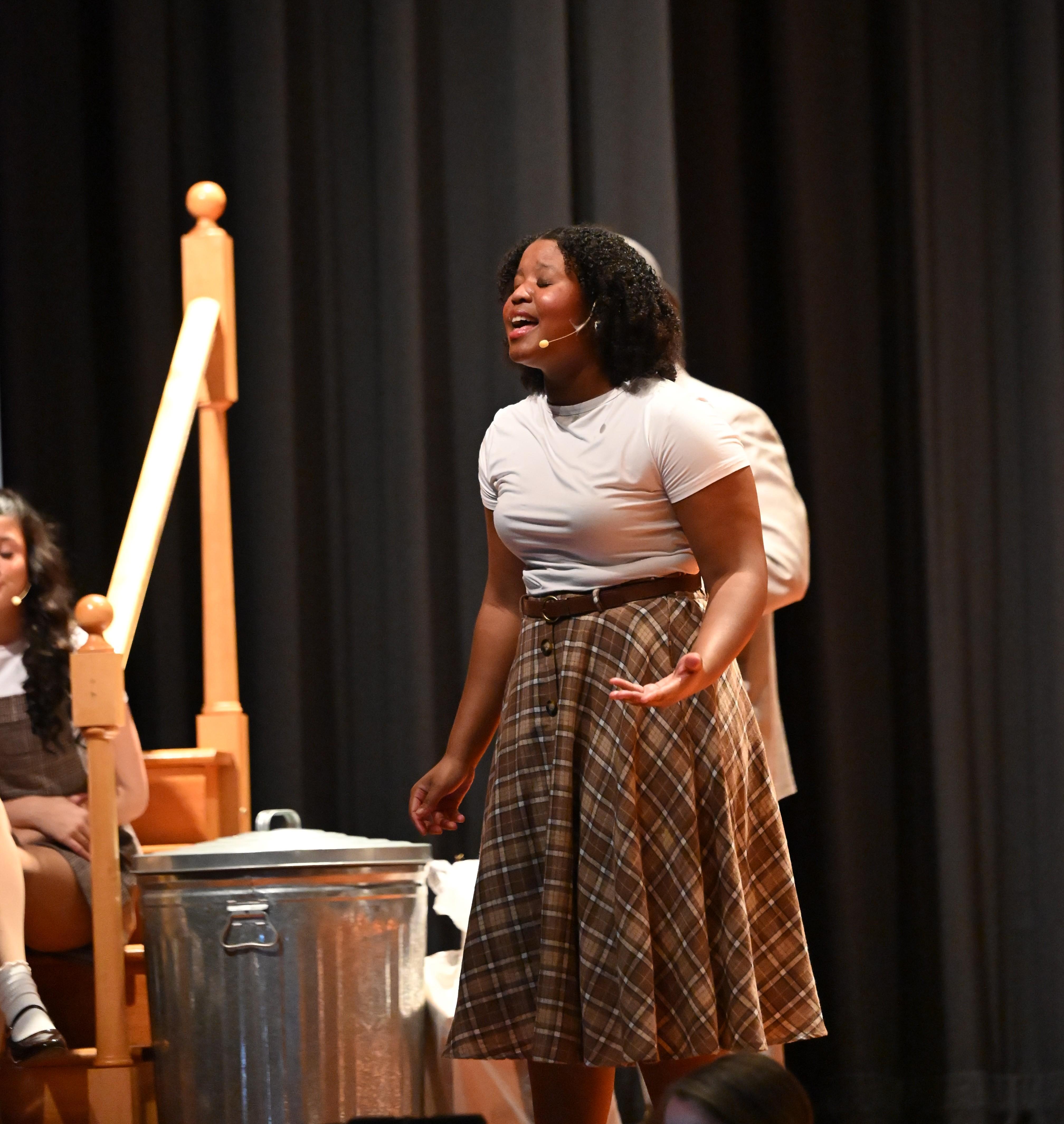 Alexandria Grant '28 sings during the Mercy/Xavier Musical in 2026