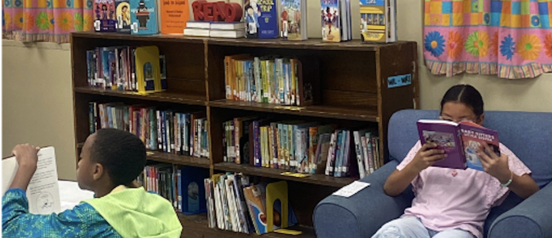 Students reading in PMS library