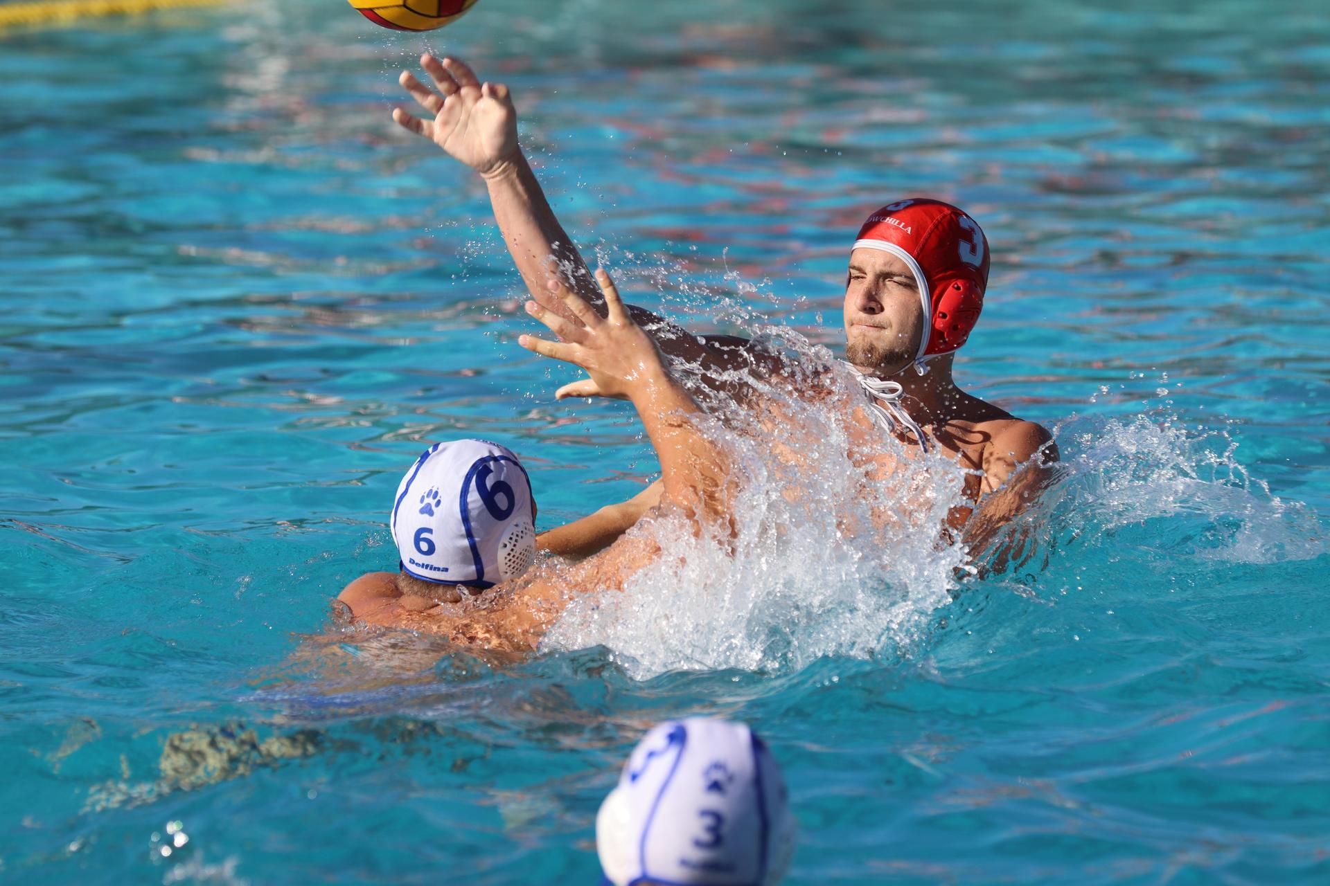 boys playing water polo against Madera