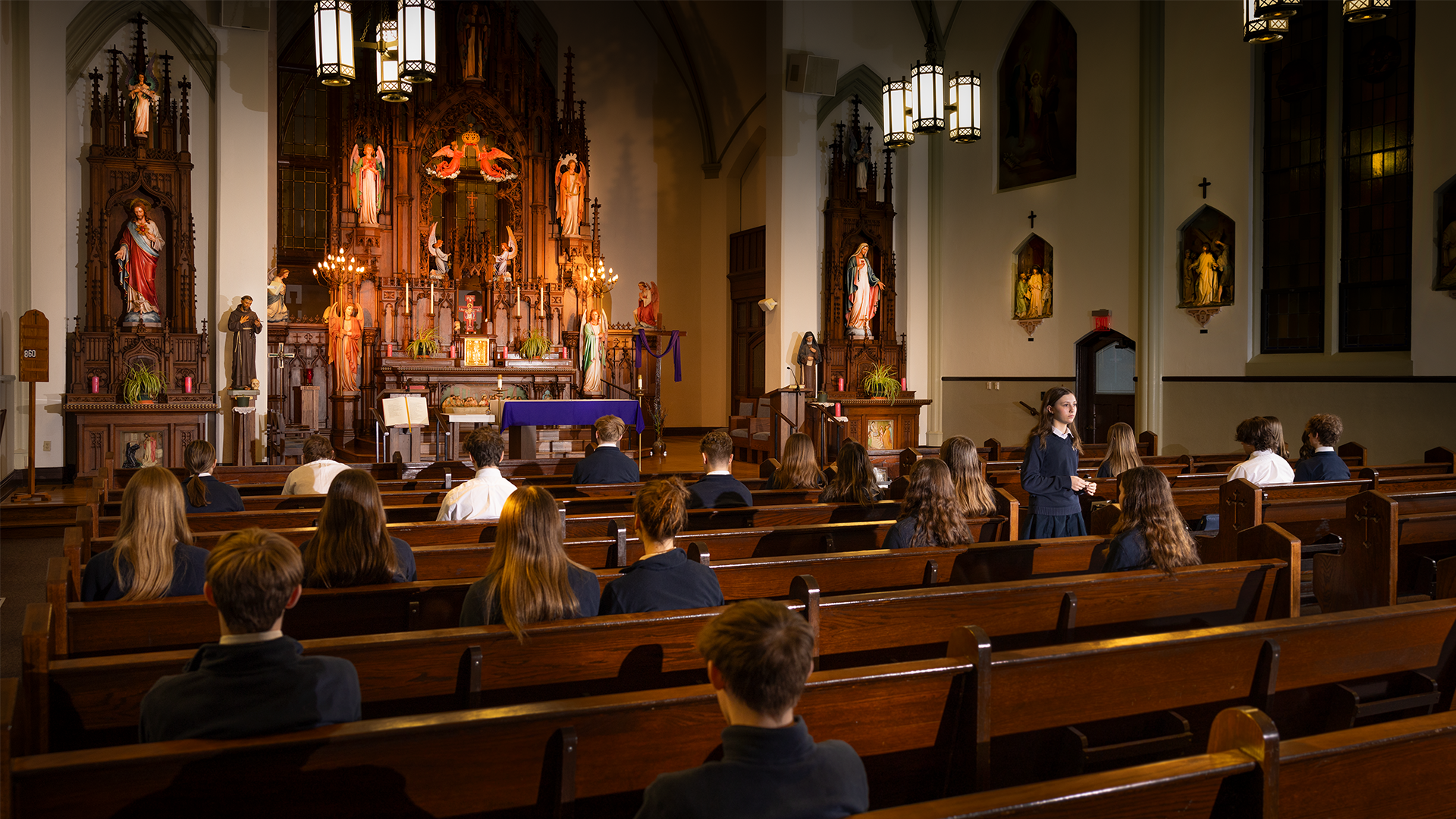students praying in the OLSH Chapel
