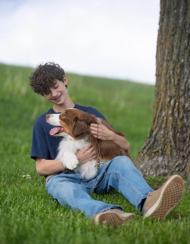 Sawyer Johnson with dog laughing