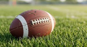 Football laying in the grass
