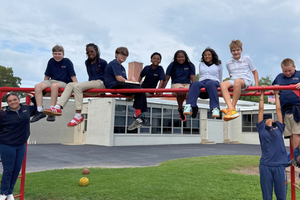 Center School students enjoying the monkey bars during recess.