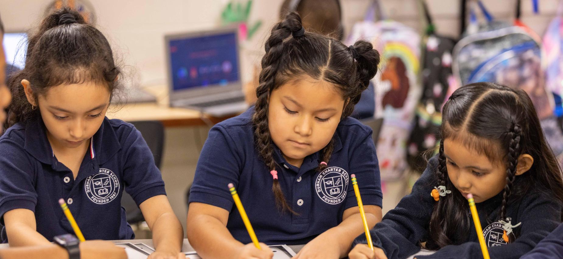 Scholars at work, writing and reading.