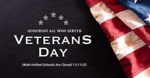 Veterans Day message with a flag in the background