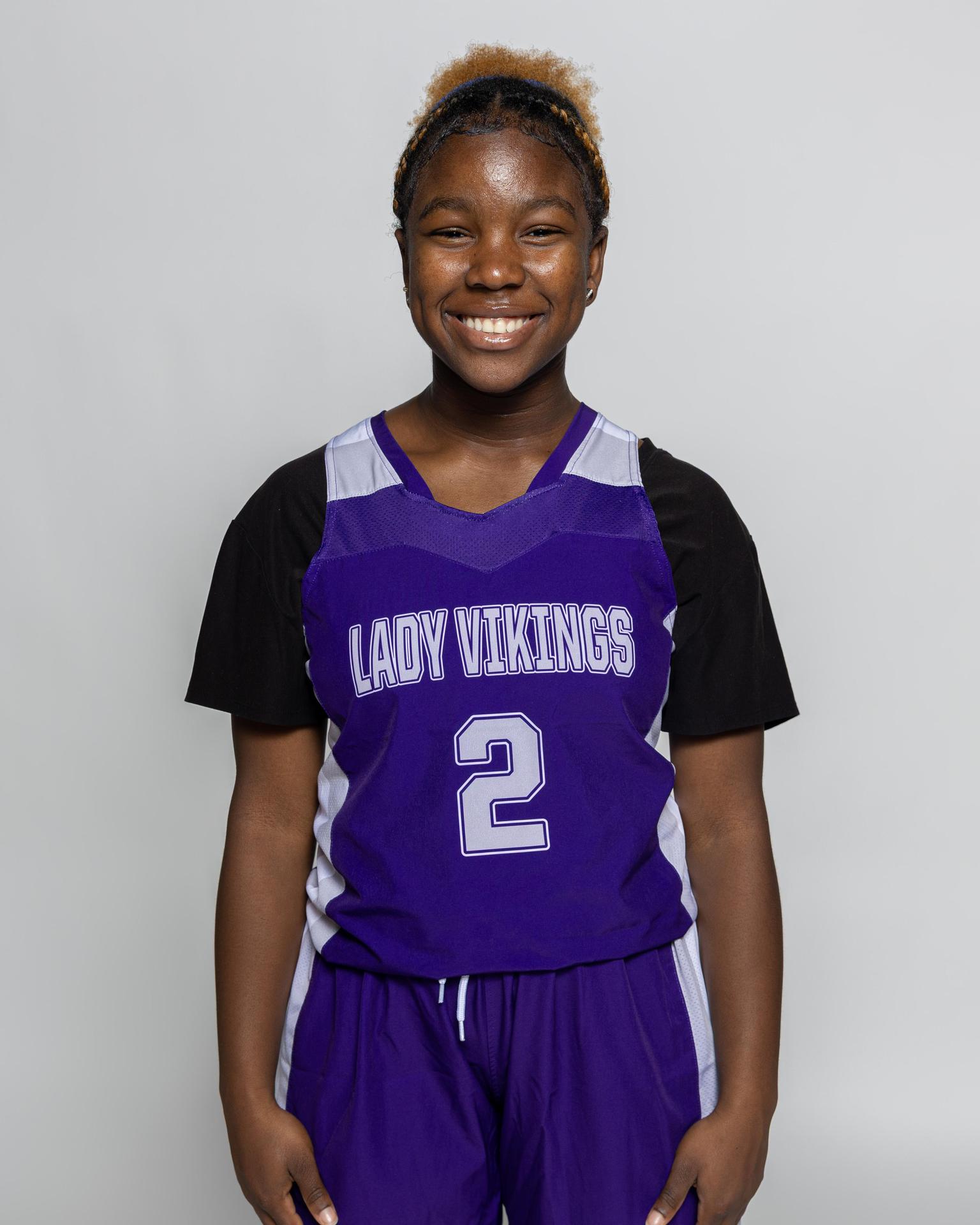 Female player number 2 posting for the roster