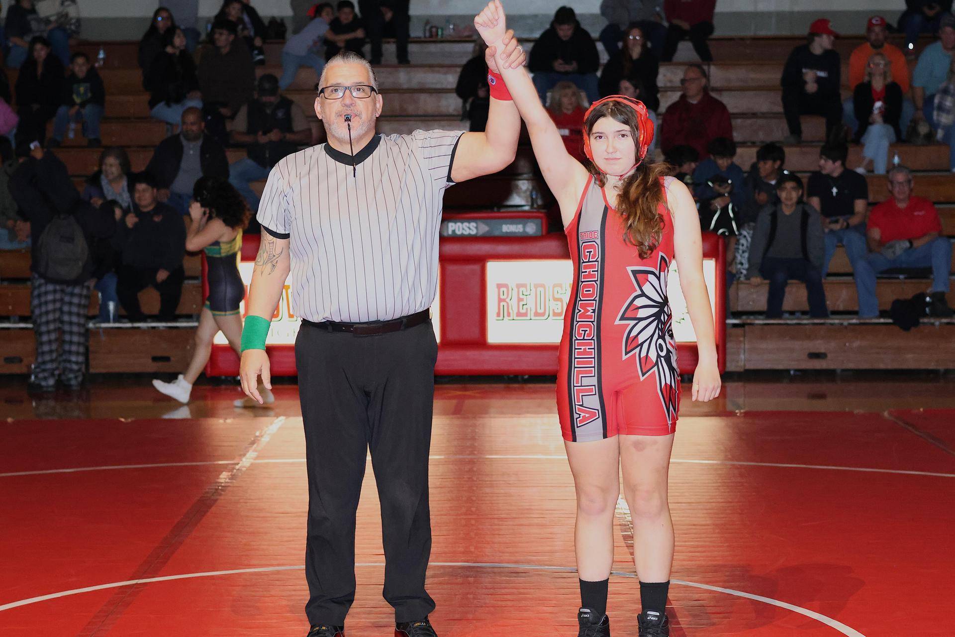 Wrestling winners with hands up 106