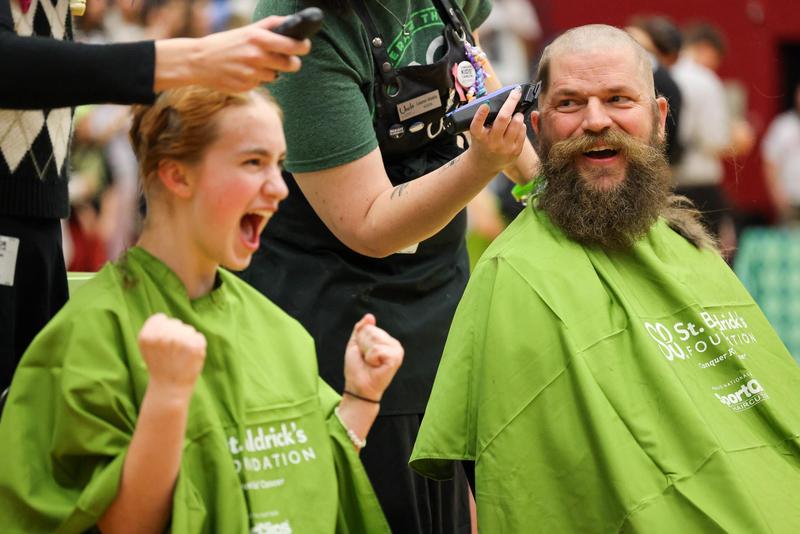 People shaving heads for cancer research