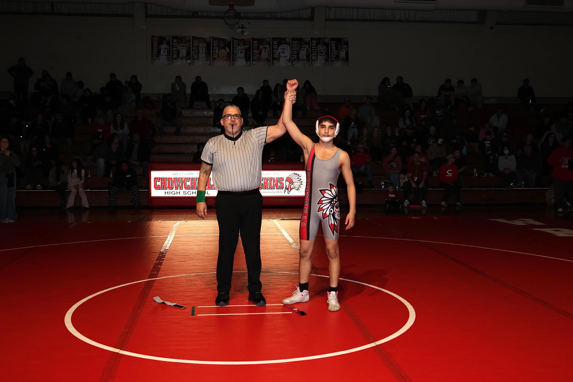 Wrestling winners with hands up 26