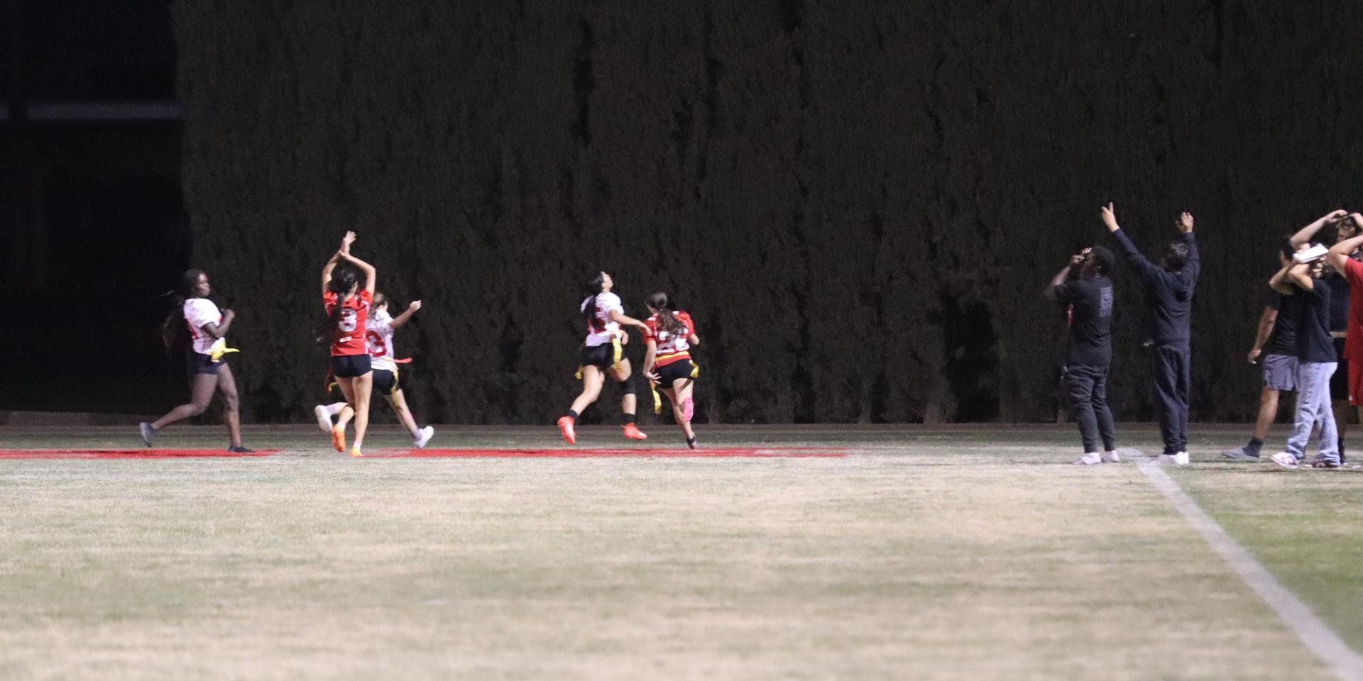 girls playing flag football