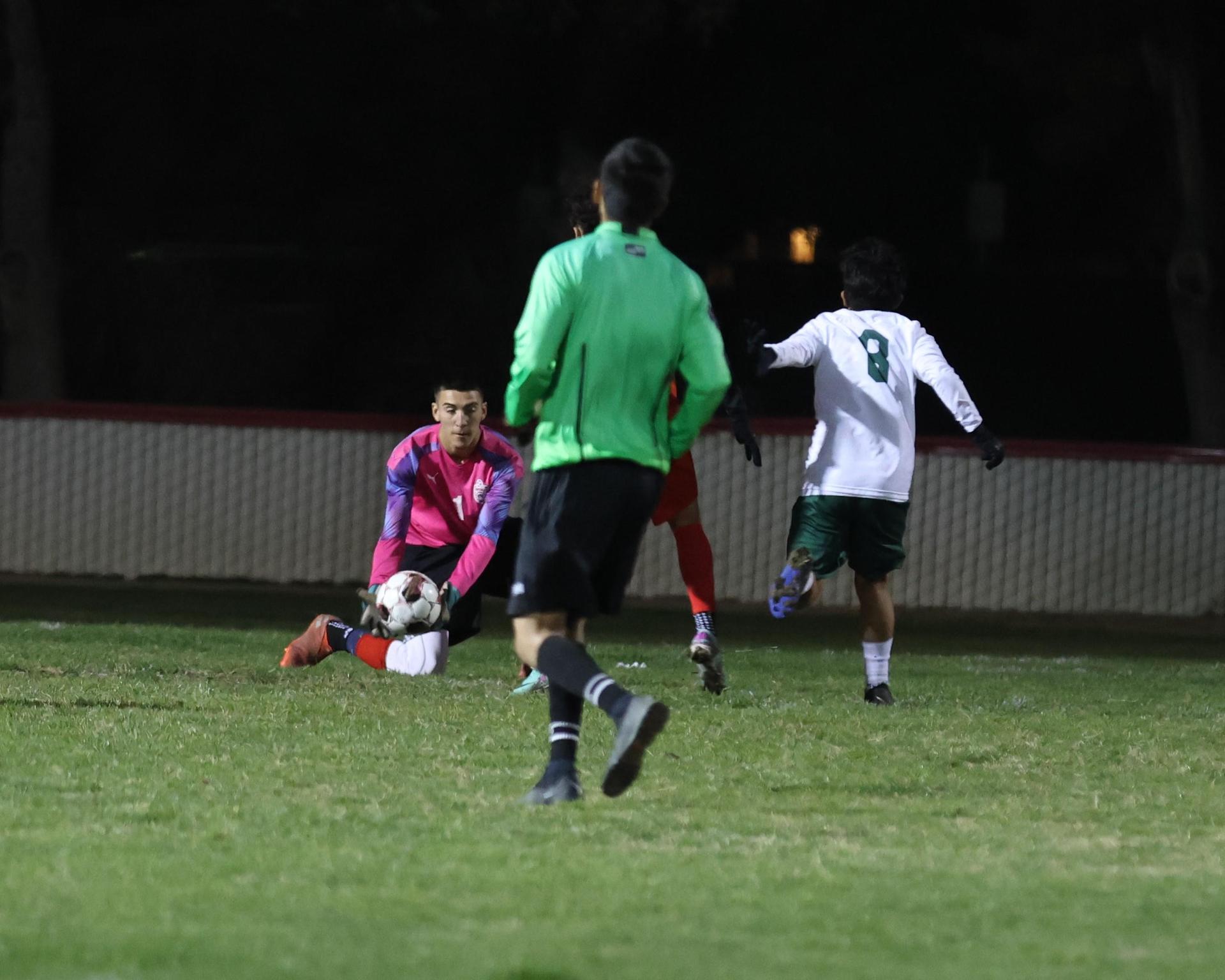 Varsity boys play soccer against Kingsburg