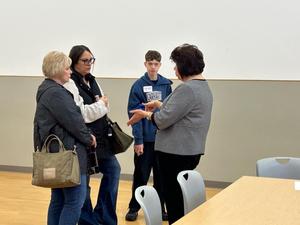 Principal Kimberly Minick talking with parents