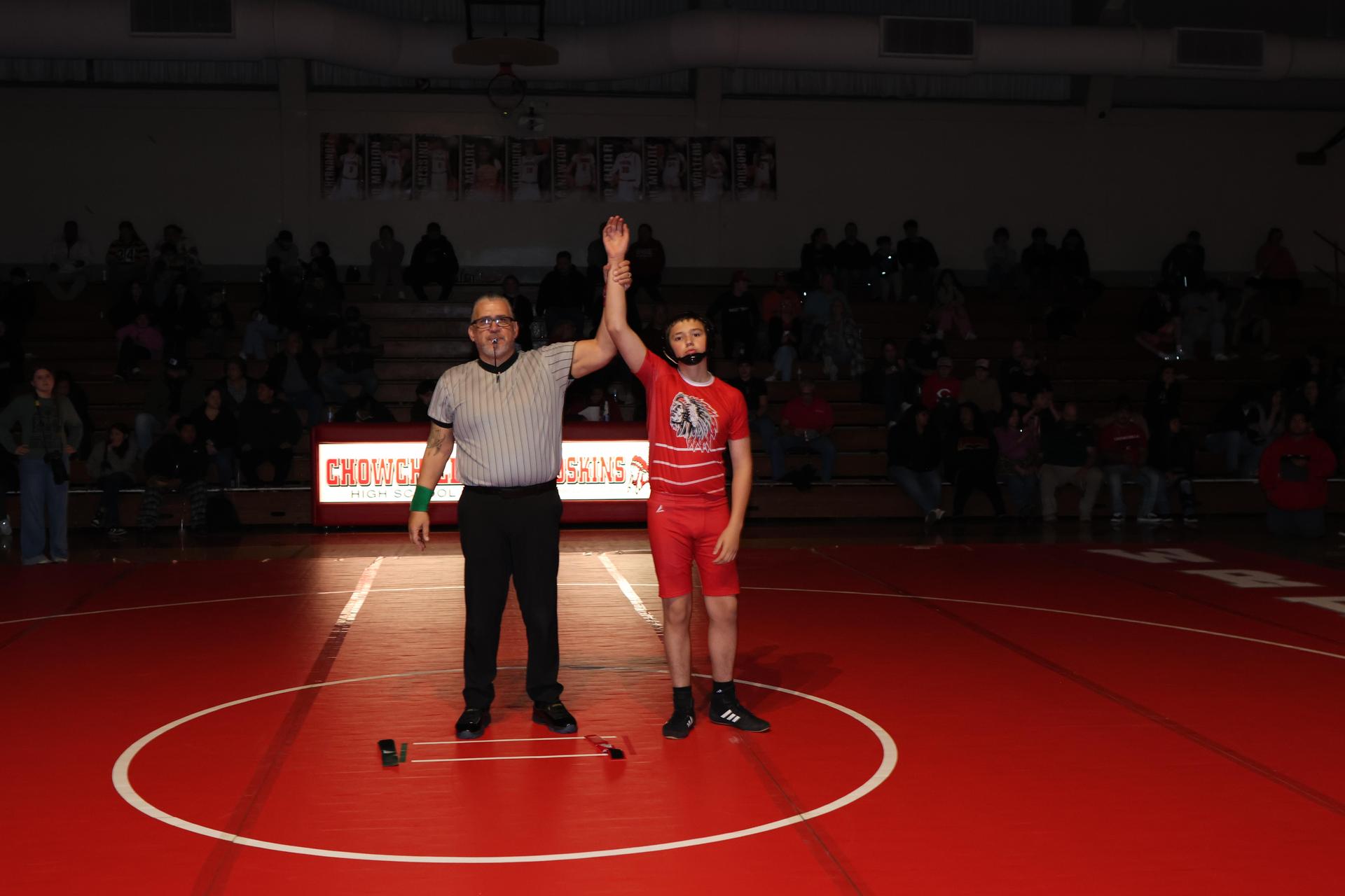 Wrestling winners with hands up 89