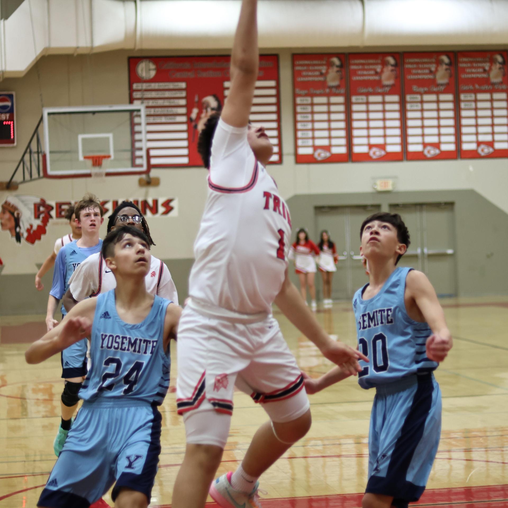junior varsity boys playing basketball against yosemite