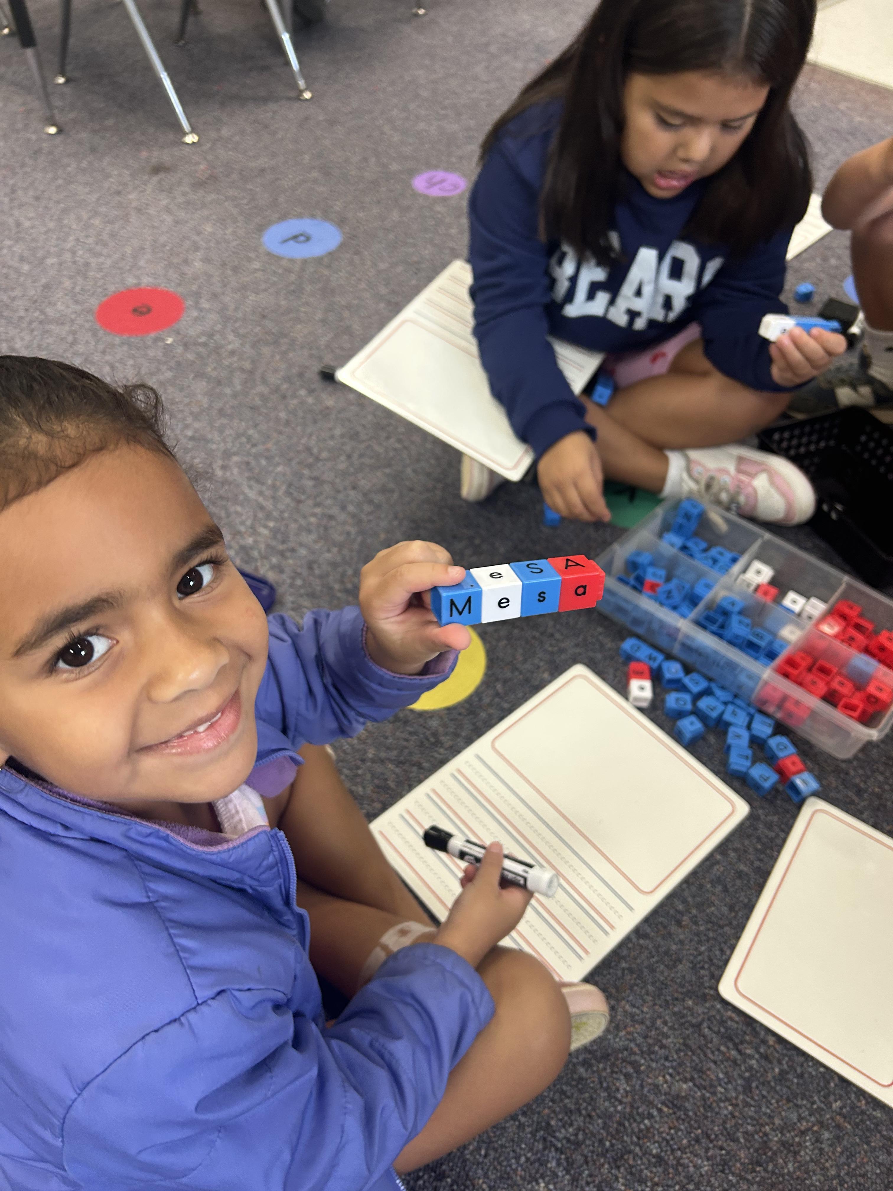 student working with spanish sound blocks
