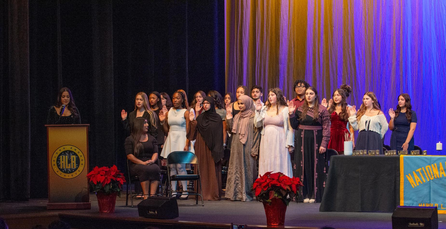 Group takes oath by putting right hand up