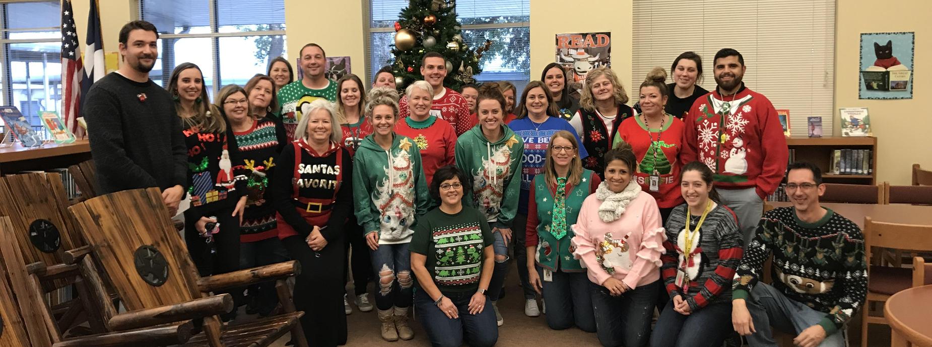 Teachers wearing Christmas sweaters