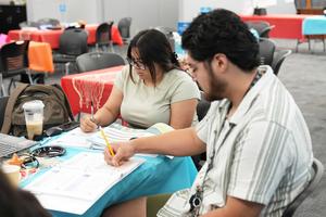 Two teachers working on an assignment