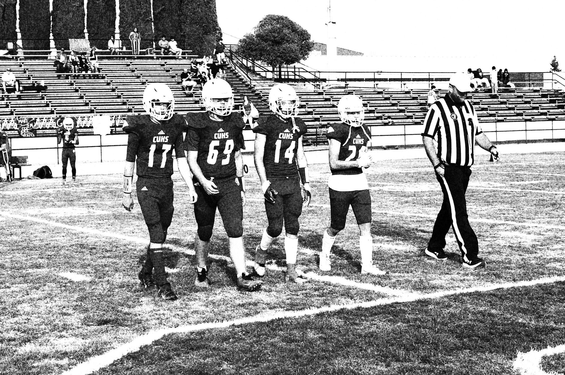Junior varsity football players in action against Riverdale