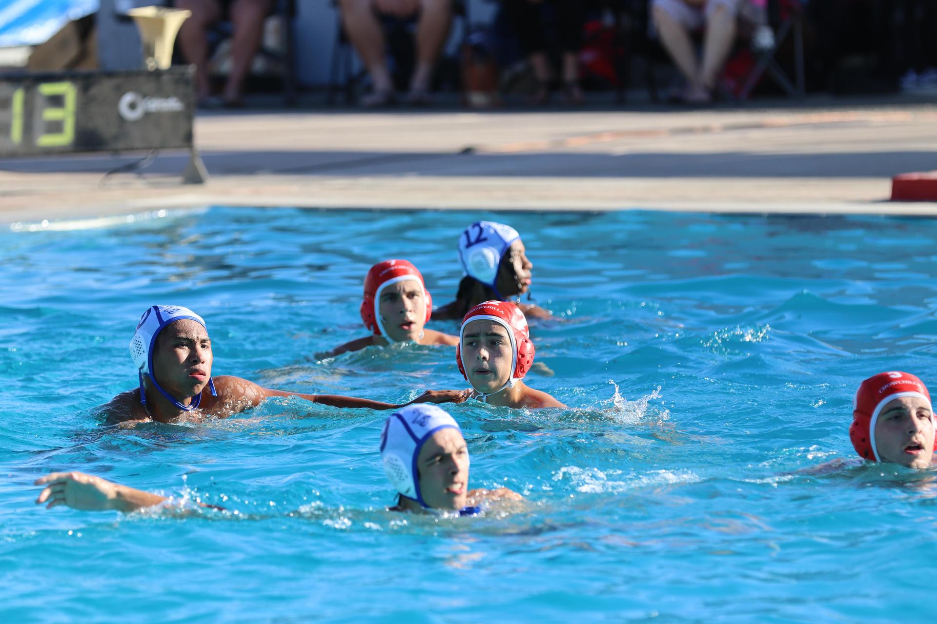 boys playing water polo against Madera