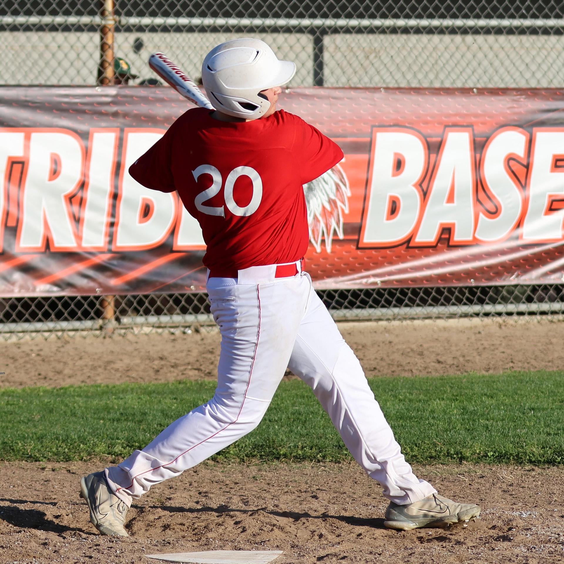 junior varsity baseball players in action