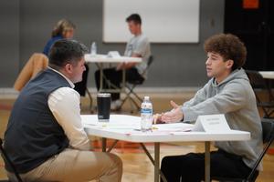 A student explains an answer to his interviewer.