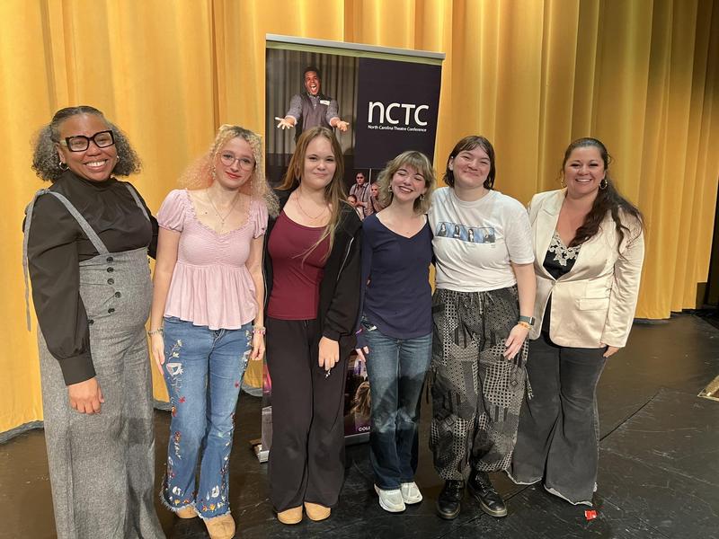 TJCA Students holding one of the awards.
