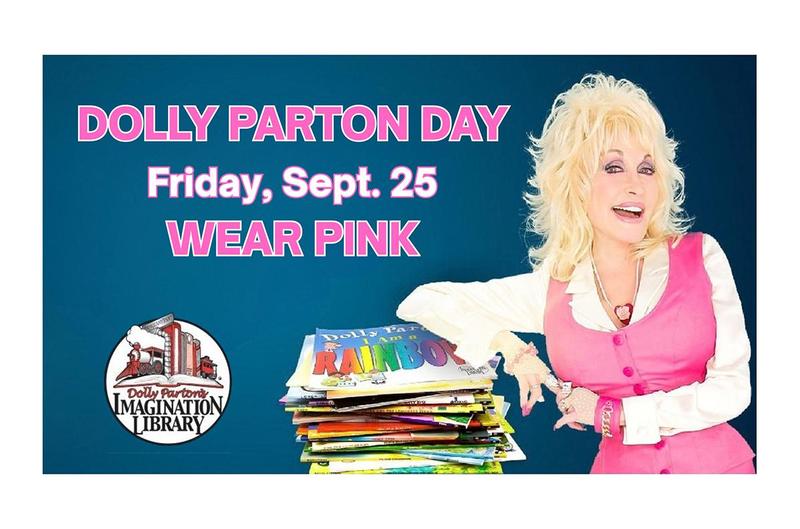 a woman in pink and white leaning on a pile of books