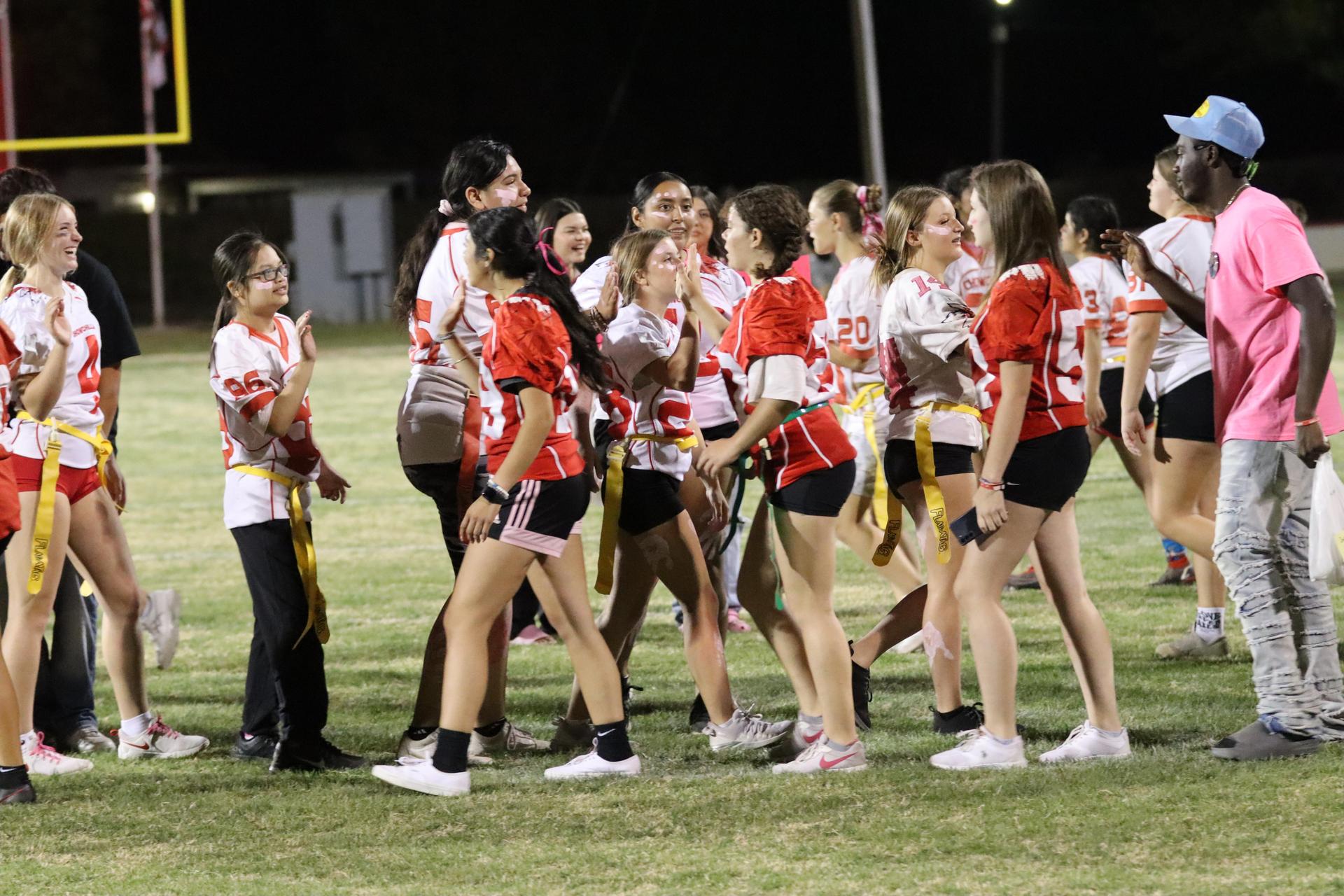 students shaking hands after the game