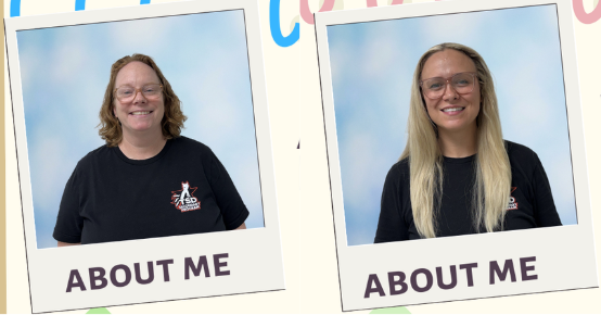 Two women in black TSD t-shirts with a blue background, both smiling and standing side by side.