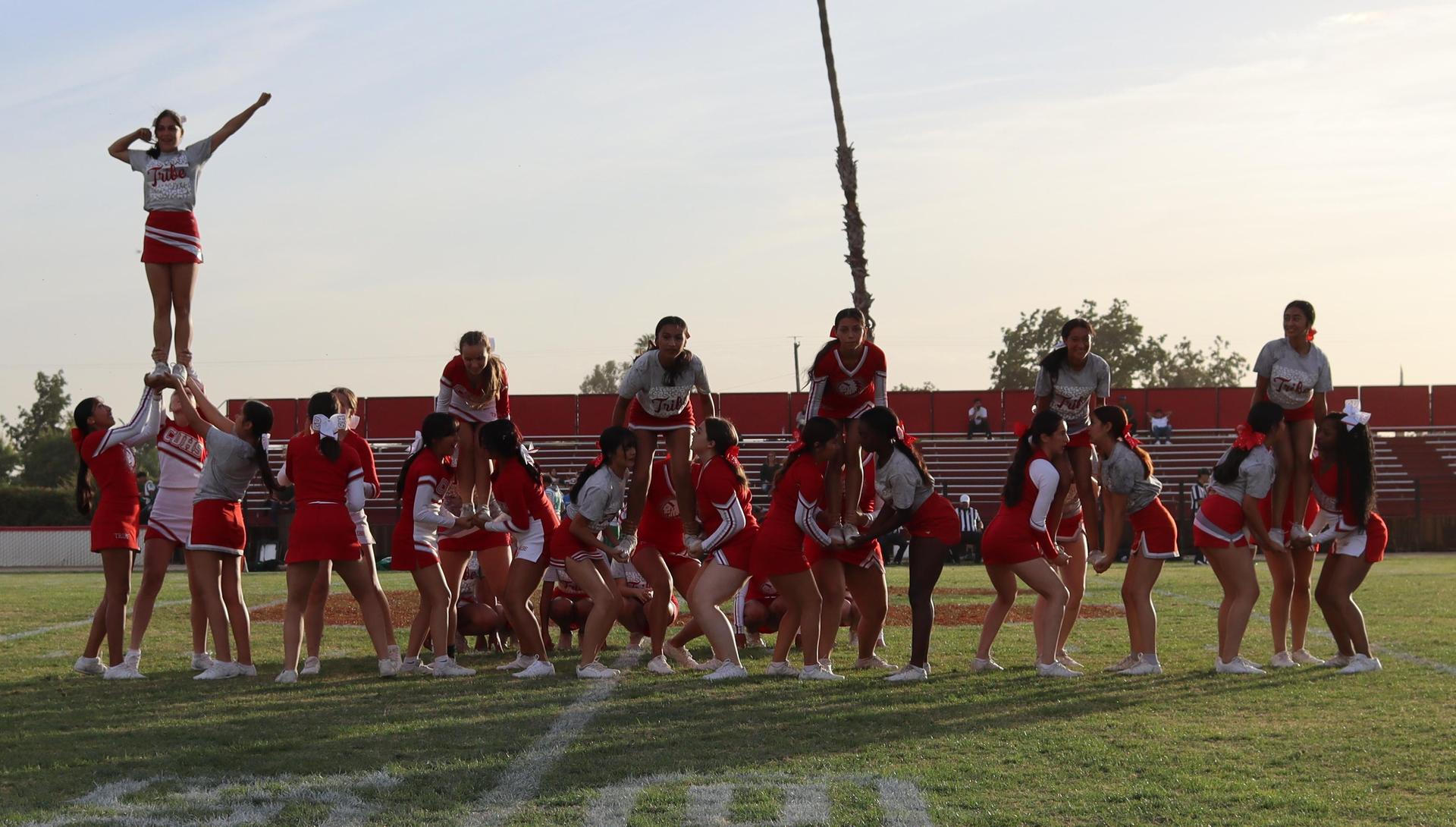 Combined cheer performing at halftime of the football game