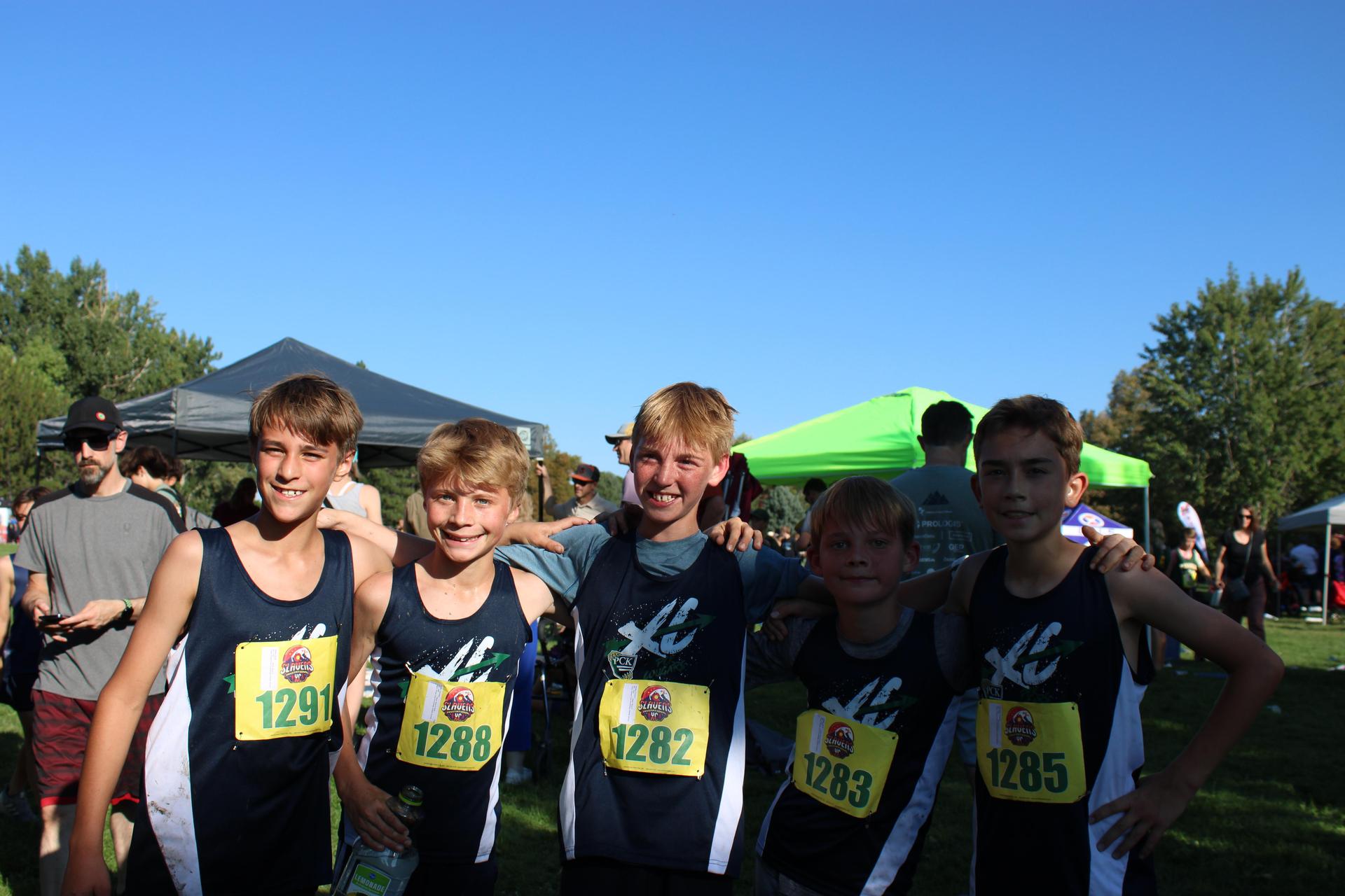 Cross Country Team Members Pose After Race