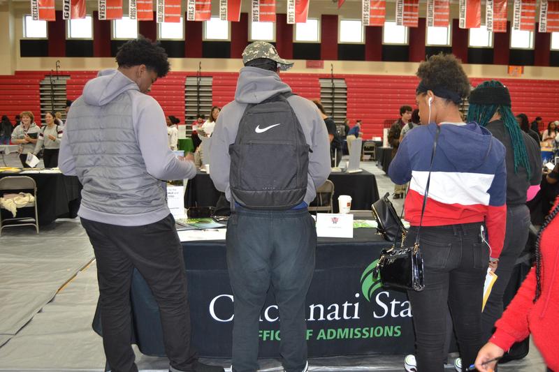students checking out colleges