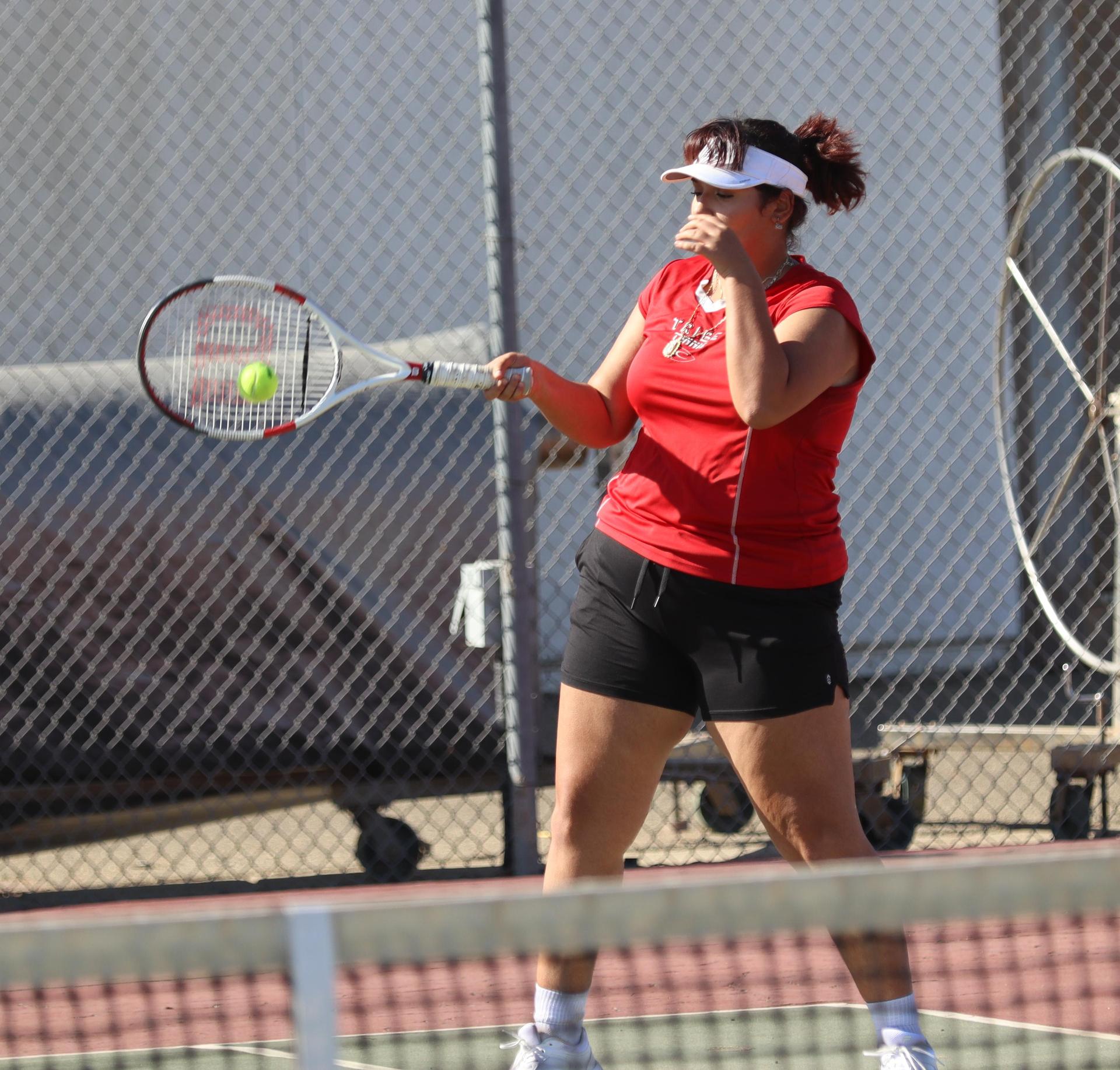 girls playing tennis against Golden Valley