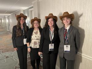 Four BPA students wear their cowboy hats after competing in Nashville.